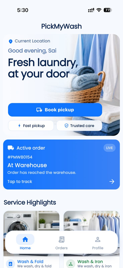 PickMyWash app home screen showing booking, coins, and live order tracking